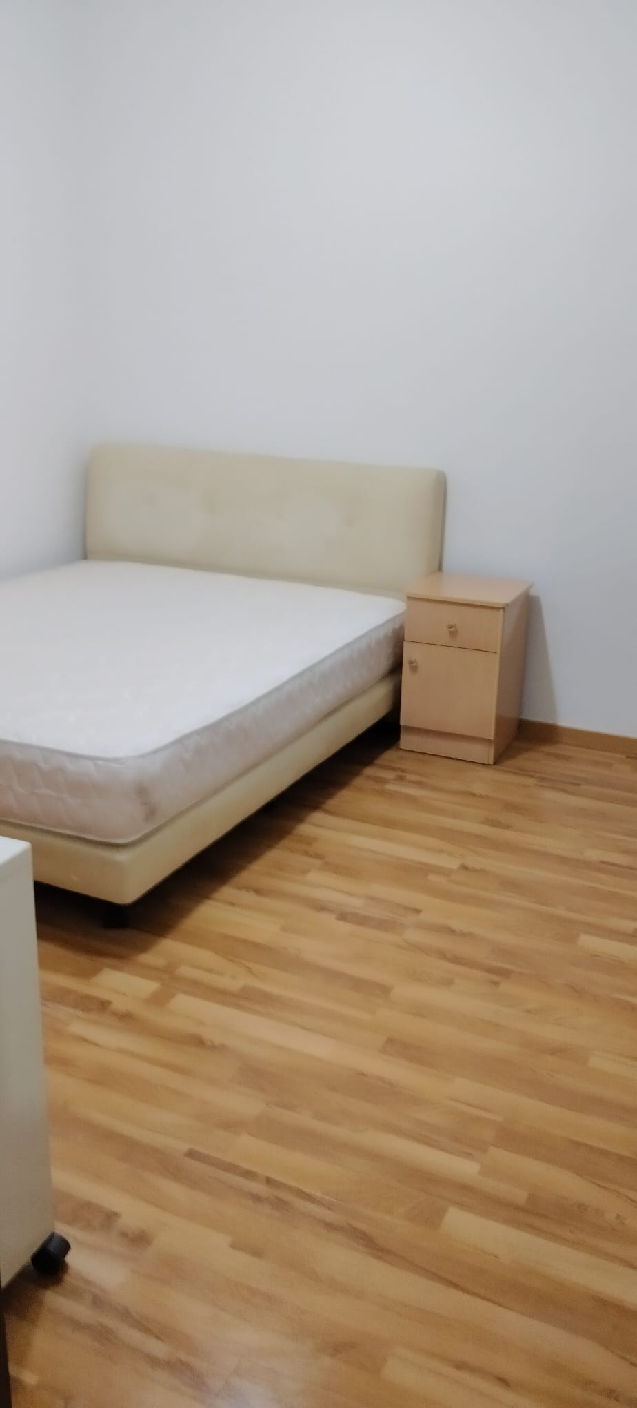 Renovated bedroom with new laminate flooring and repainted walls by RK E&C, Geylang