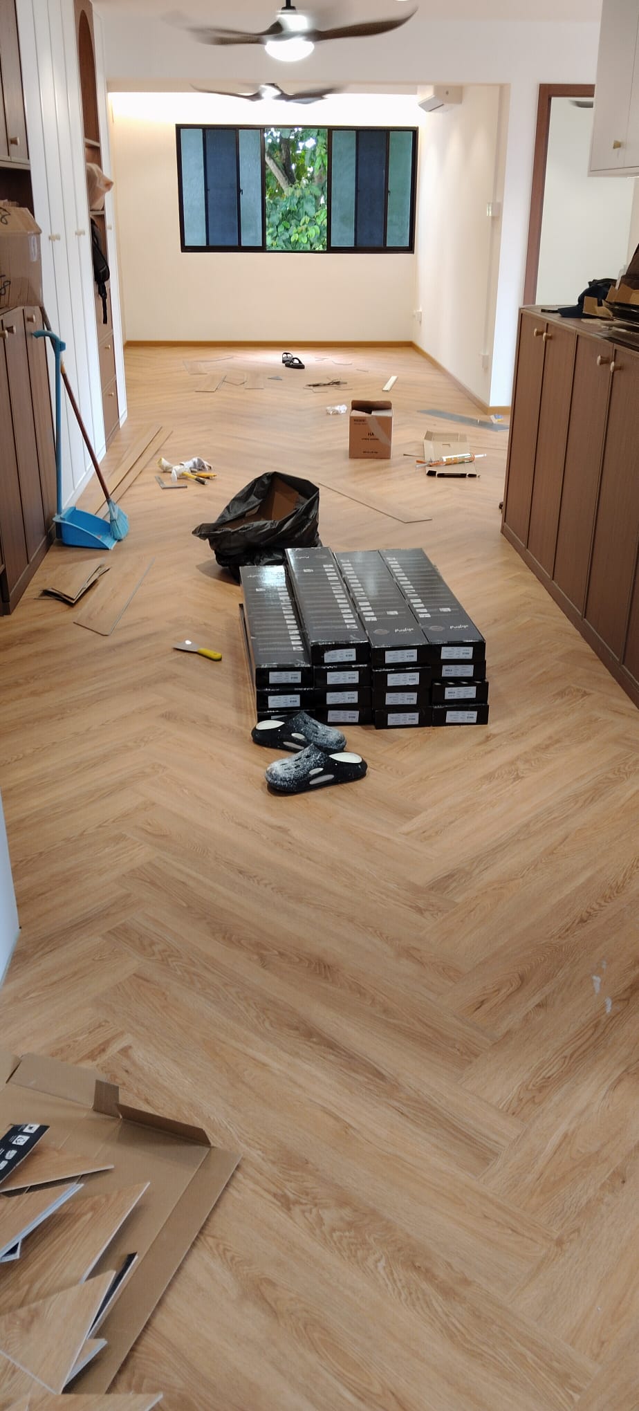 Herringbone vinyl flooring installation in progress by RK E&C, Bukit Panjang
